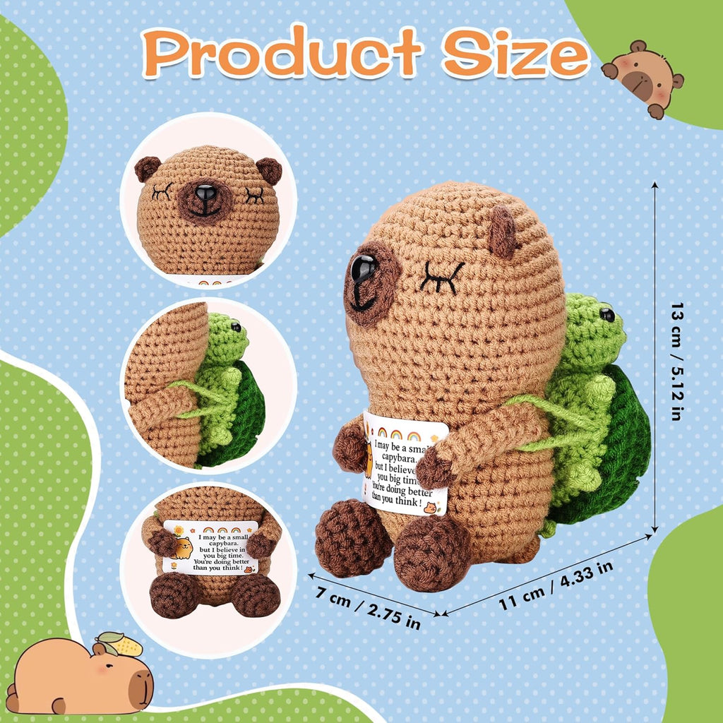 Crocheted animal plush toy with measurements on a blue background