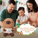 Family with a stuffed animal toy labeled 'Your Pocket-Sized Emotional Support Buddy' in a home setting.