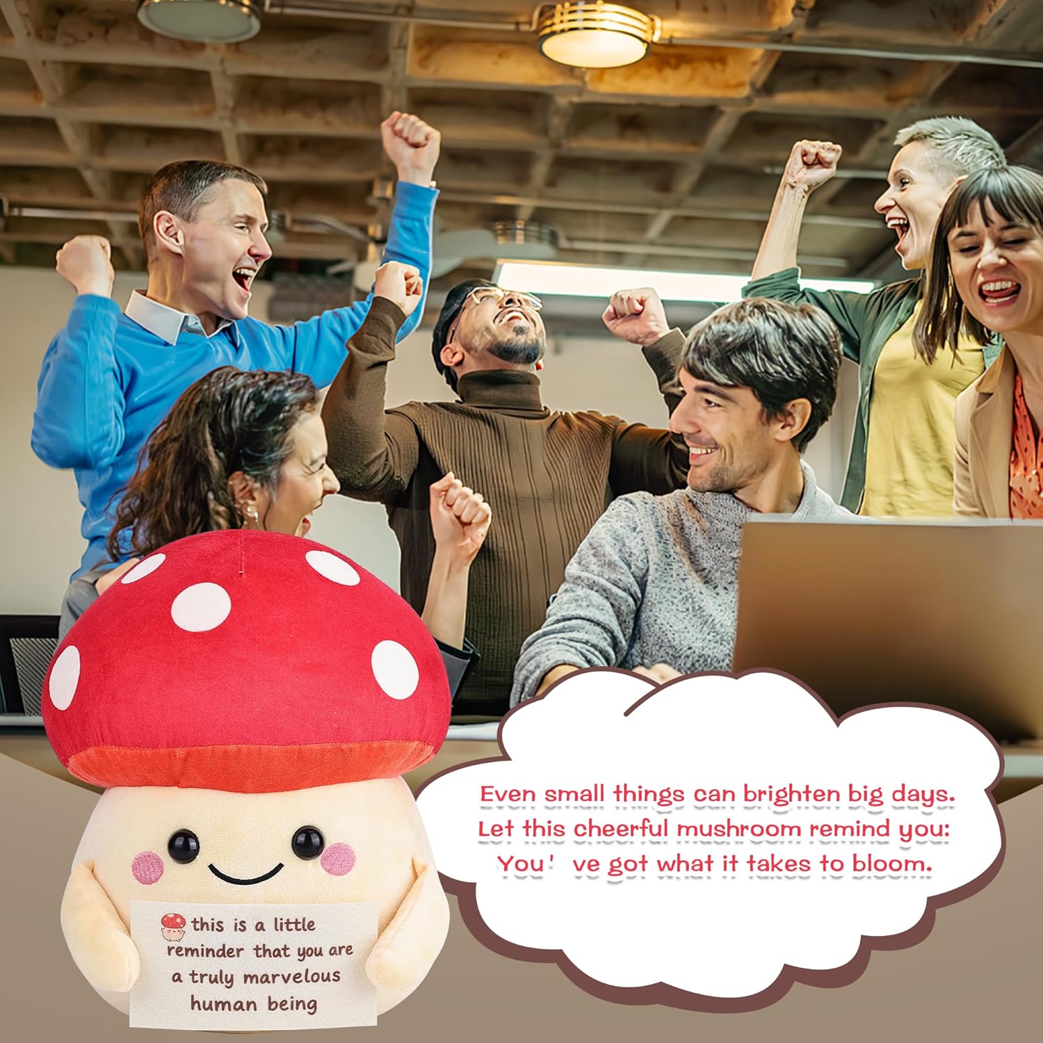 Group of people celebrating with a mushroom plushie and motivational text in an office setting.