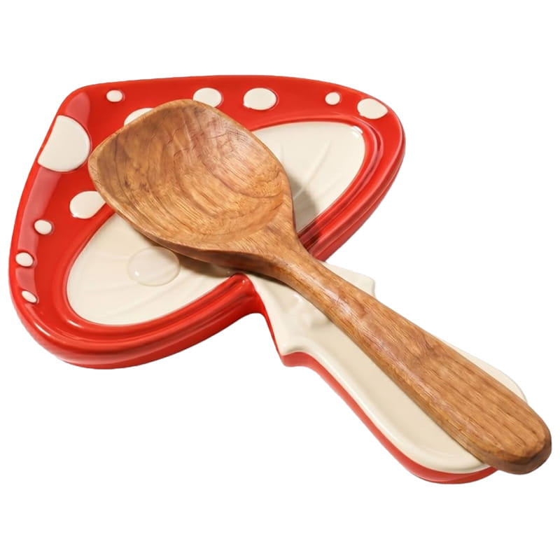 Wooden spoon on a red heart-shaped plate with white polka dots