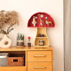Wooden cabinet with decorative items including a red shelf with animal figurines and a vase with plants.