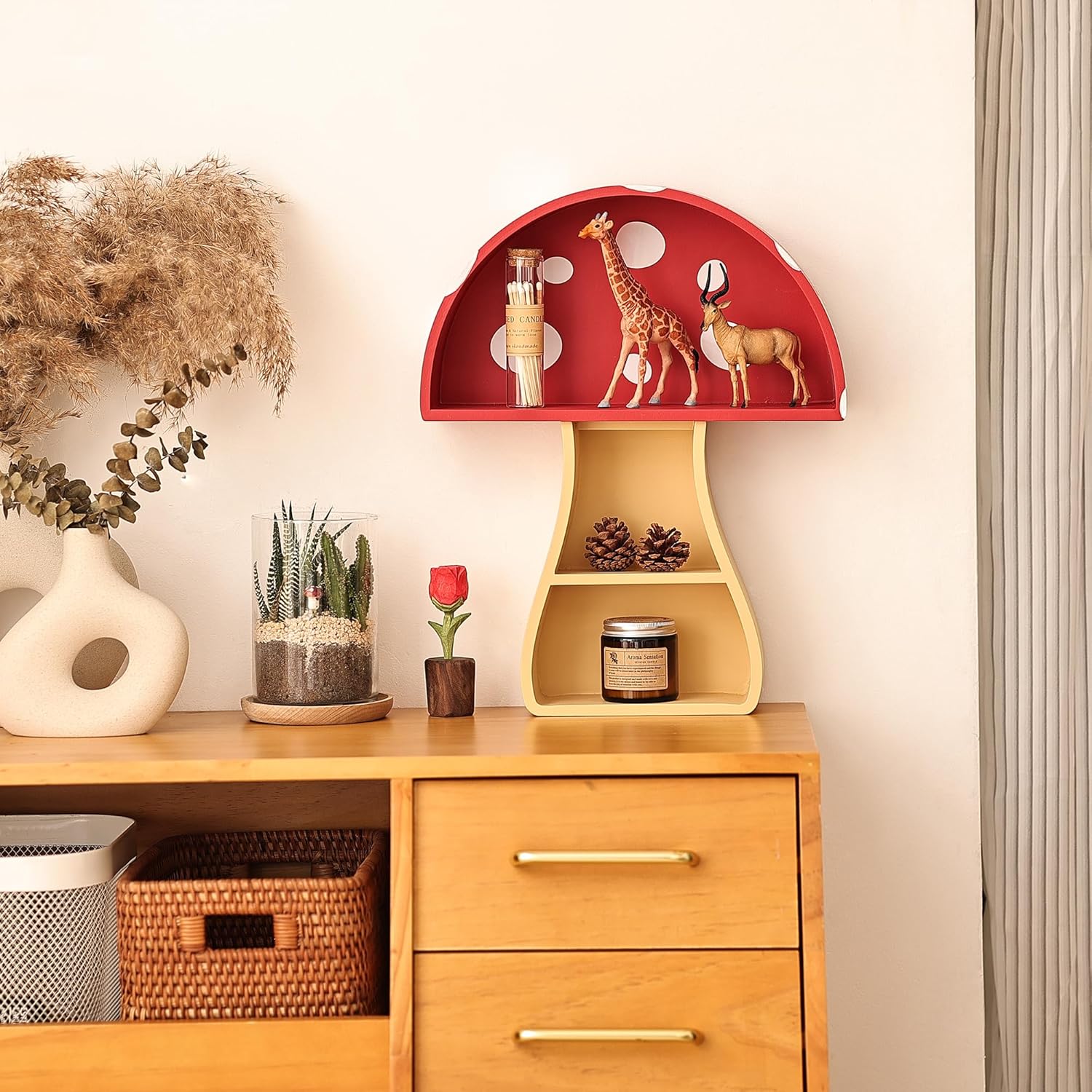 Wooden cabinet with decorative items including a red shelf with animal figurines and a vase with plants.