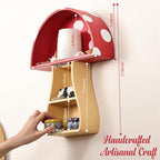Wall-mounted mushroom-shaped shelf with dimensions and a hand interacting with it on a white background.