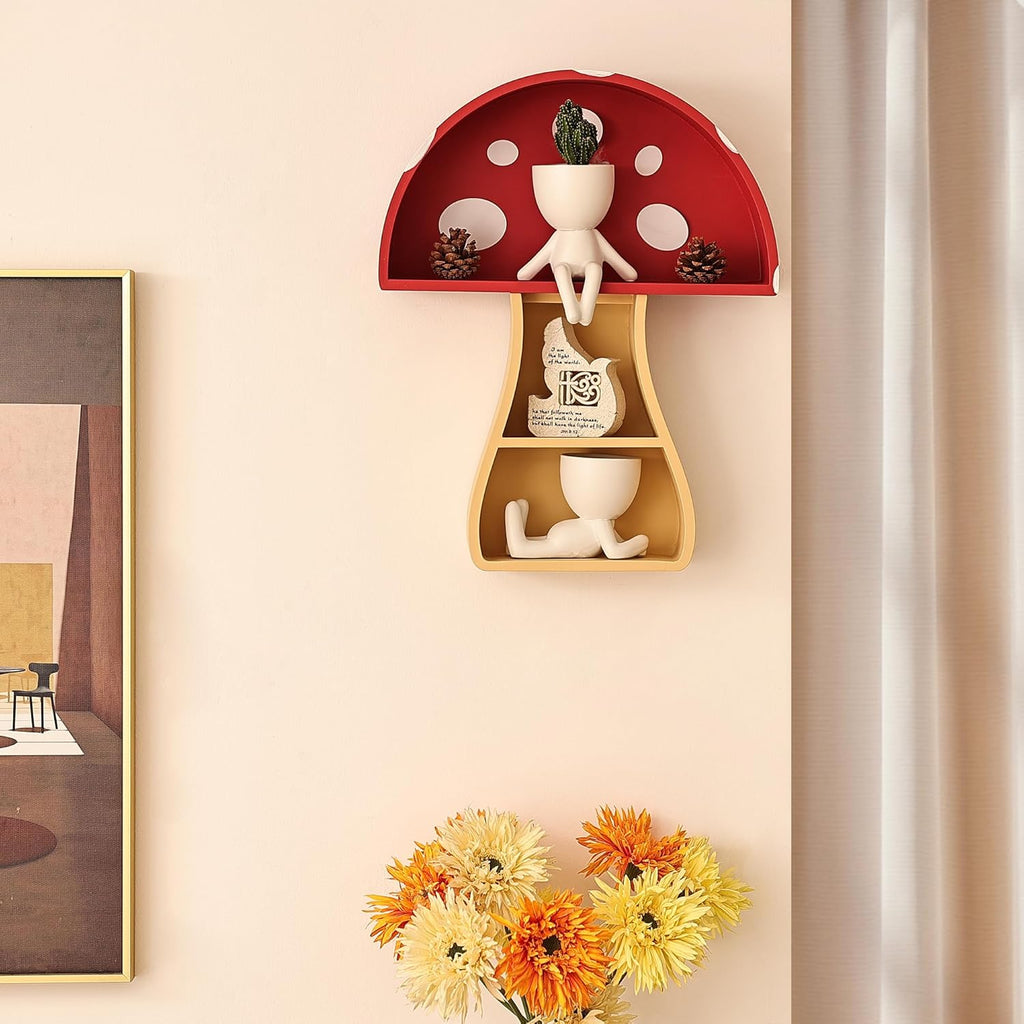 Decorative wall shelf shaped like a mushroom with small figurines and plants on a beige wall.