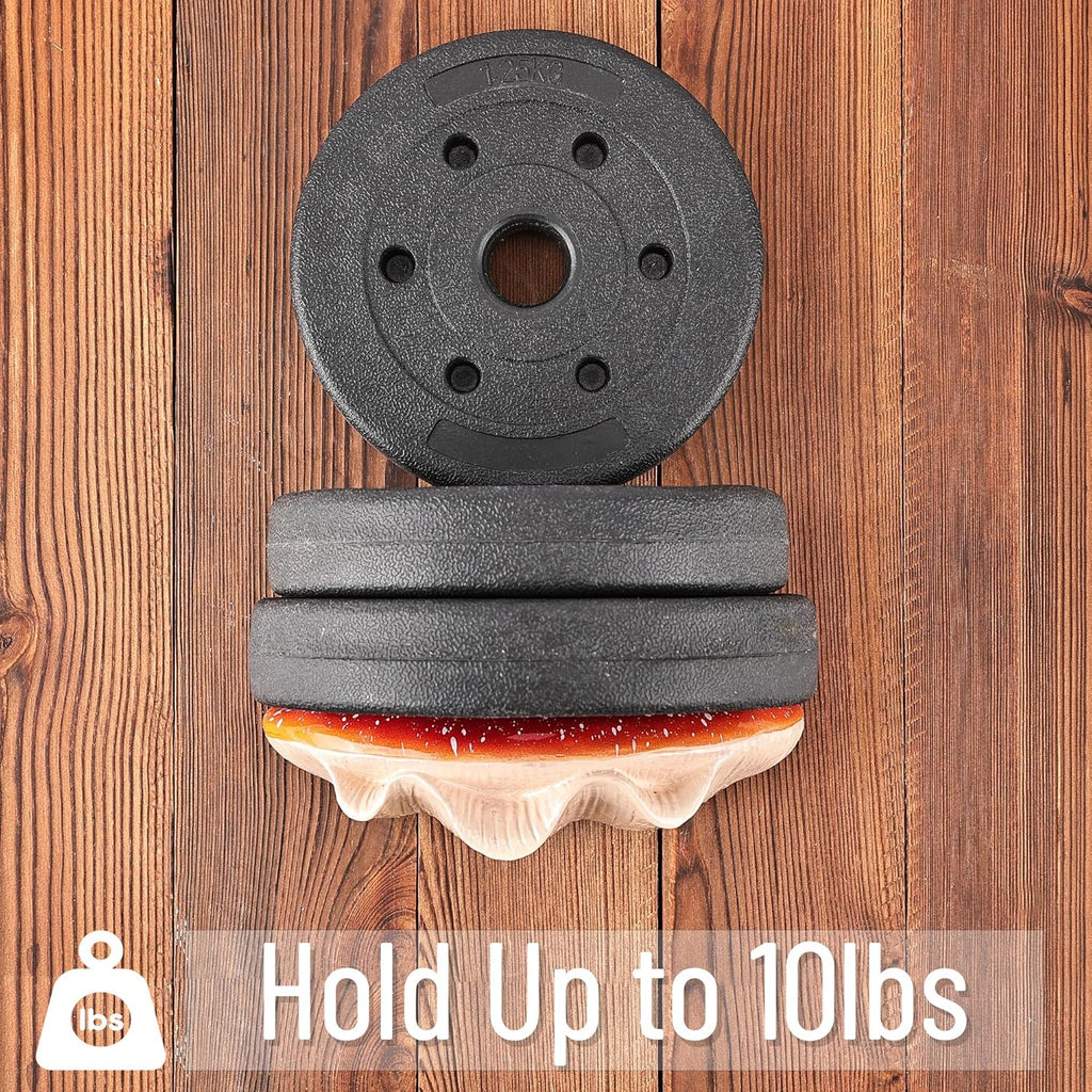 Stack of weight plates on a wooden surface with text indicating weight capacity.