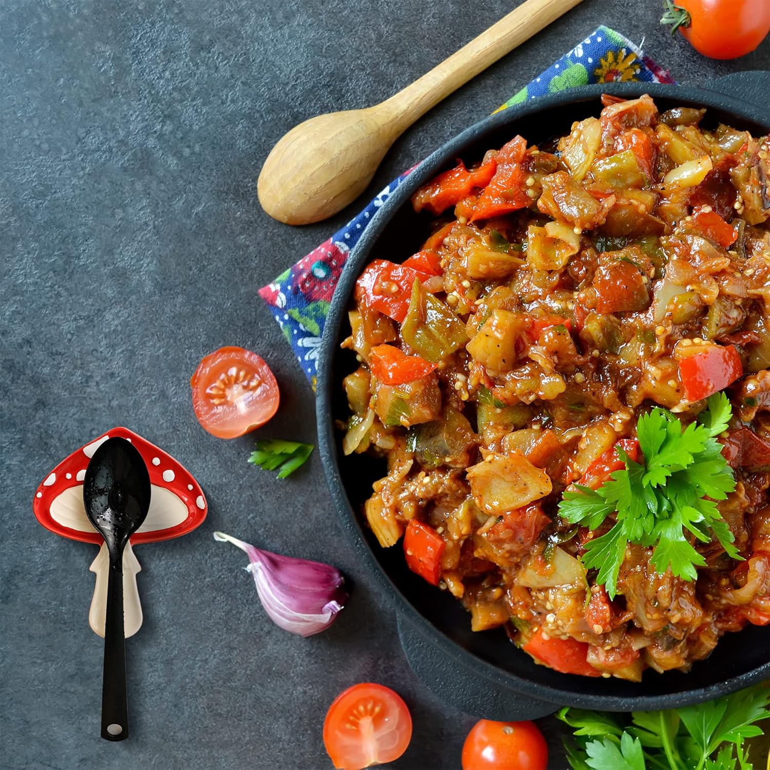 Stir-fried vegetables with a wooden spoon on a dark surface